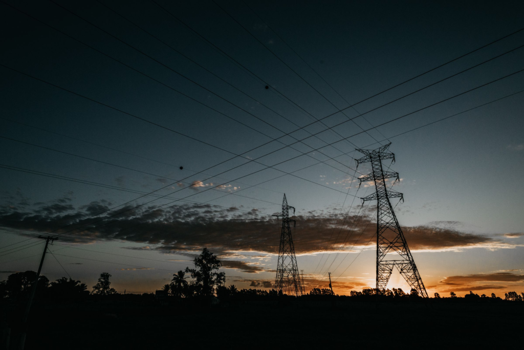 Power transmission towers at sunset